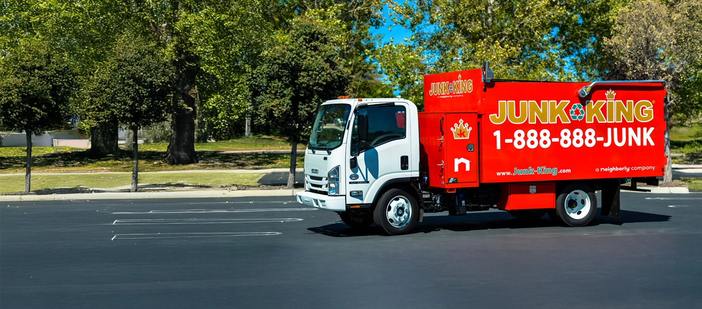 A Junk King truck in front of job site.