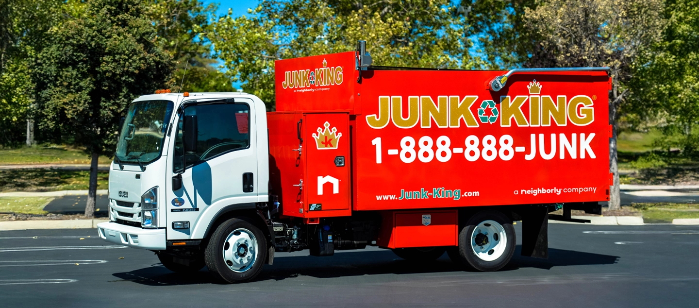 A Junk King truck in front of job site.