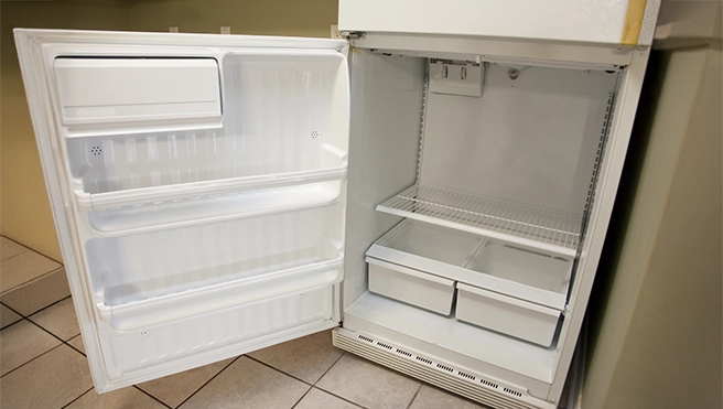 Photo of an open refrigerator.