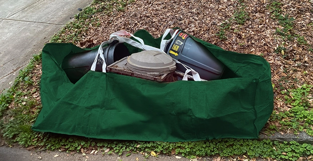 Full green dumpster bag.