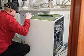 Junk King professional removing a dishwasher.