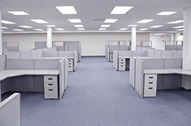 Brightly light office with several desks.