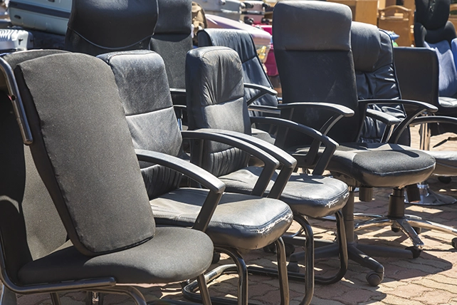 A row of old office chairs.