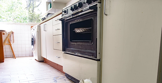 A modern kitchen with an old oven.