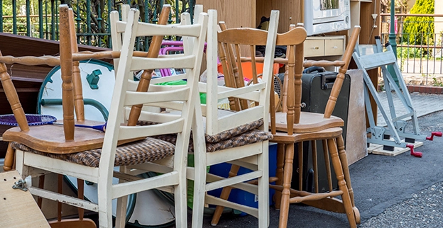 A pile of wooden chairs.