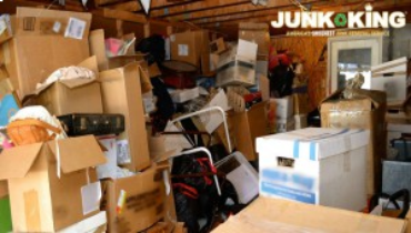 A cluttered garage filled with various boxes.
