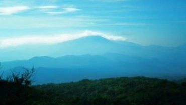 A view of a mountain ranges from a distance.