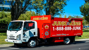 A junk truck parked on the roadside.