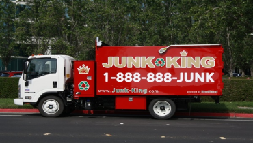 A Junk King truck parked on a street.